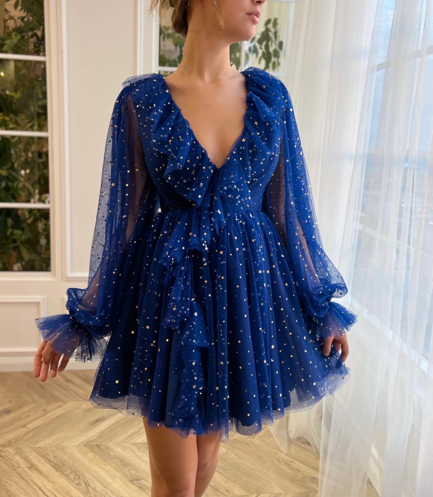Blue mini dress with long sleeves and starry fabric
