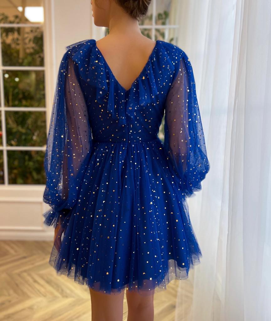 Blue mini dress with long sleeves and starry fabric