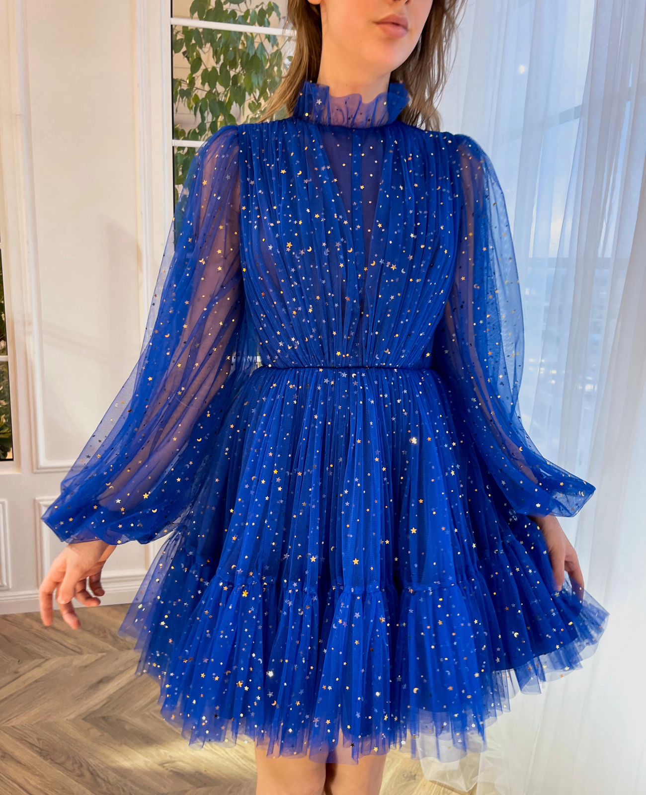 Blue mini dress with long sleeves and starry fabric