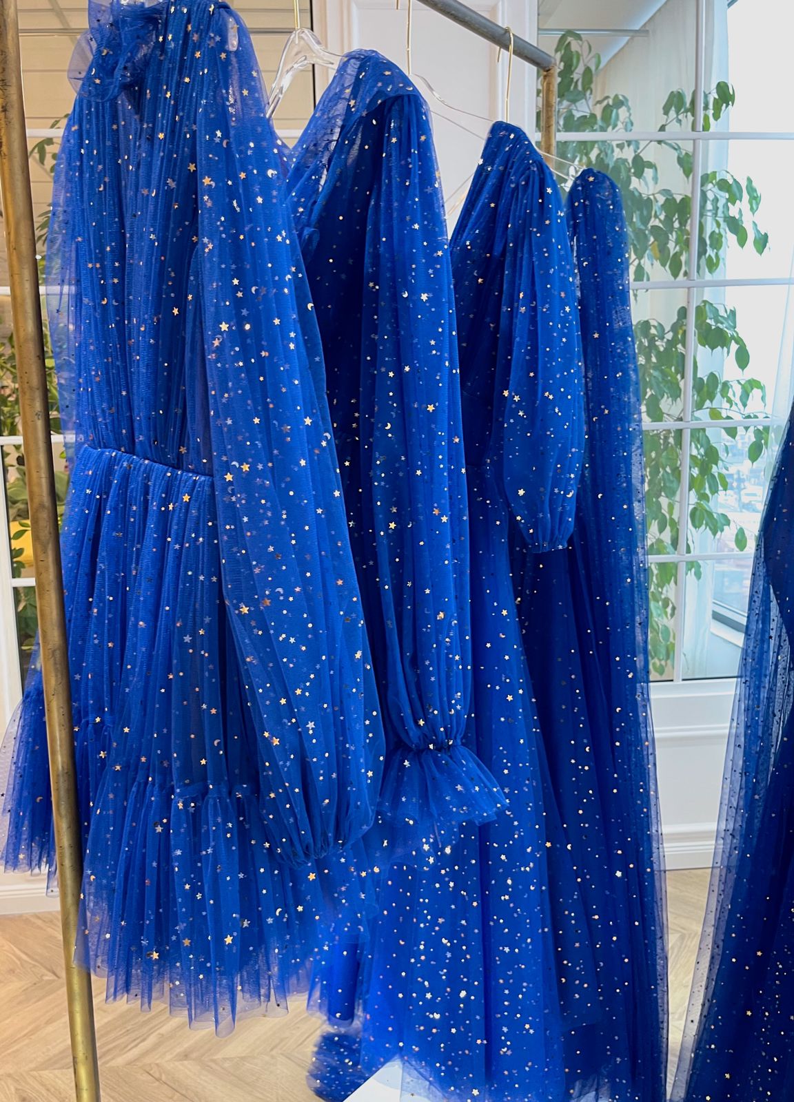 Blue mini dress with long sleeves and starry fabric