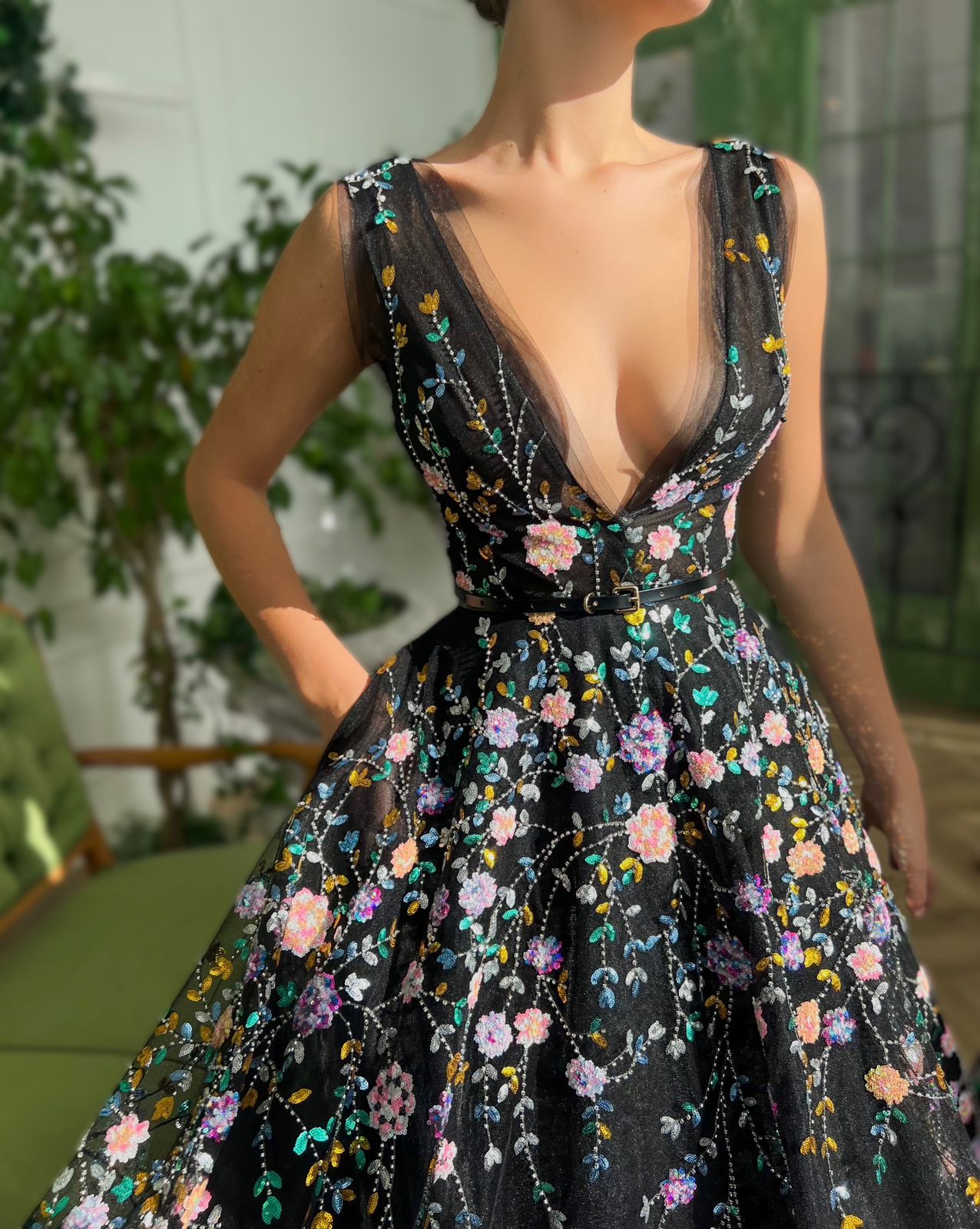 Black A-Line dress with no sleeves, v-neck and flowers