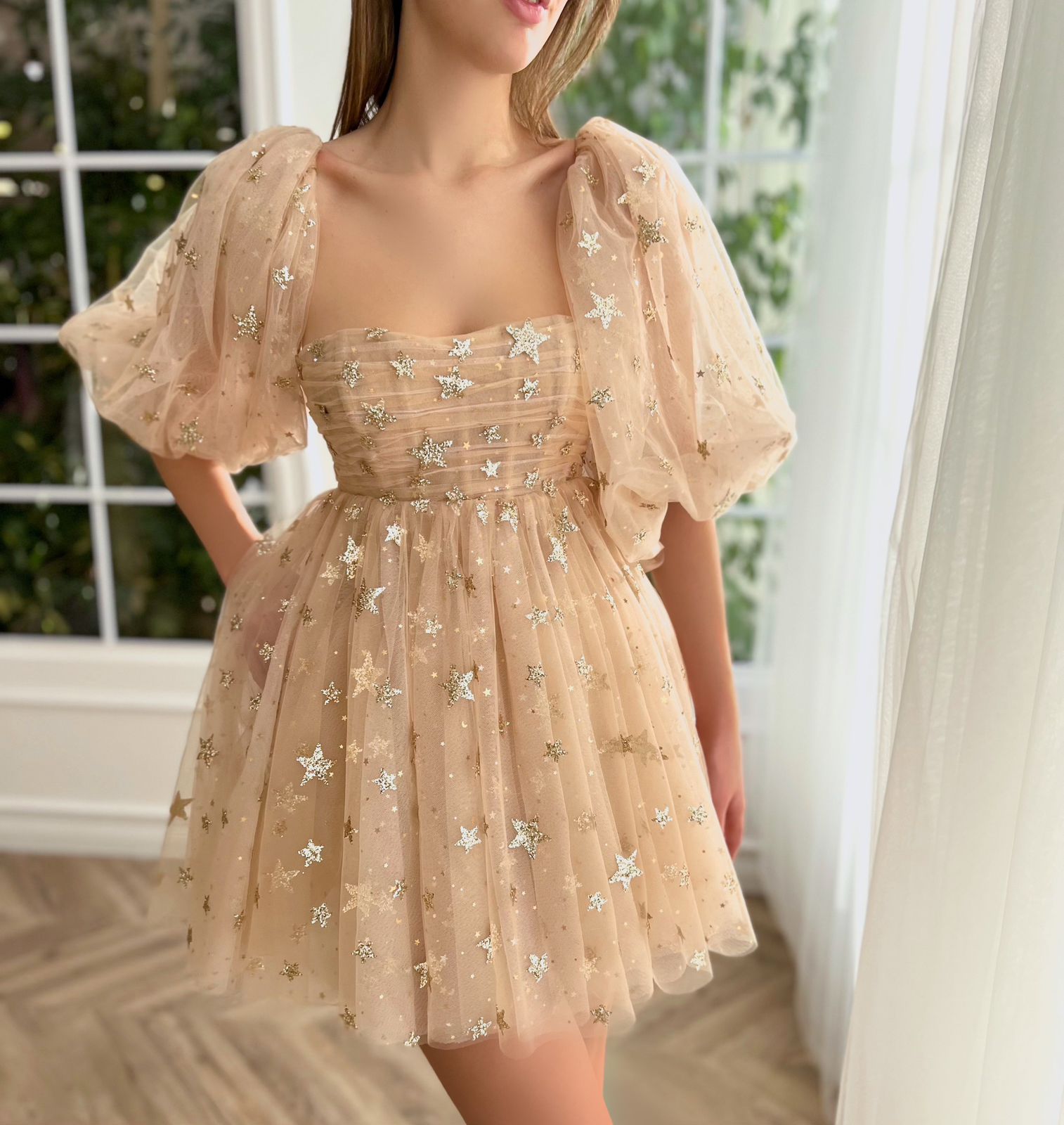 Beige mini dress with starry fabric and short sleeves