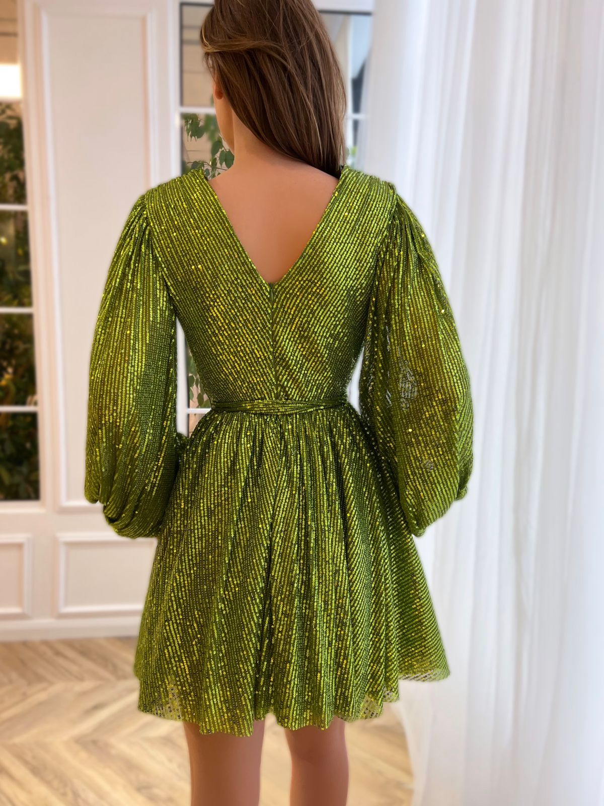 Green mini dress with sequins, v-neck and long sleeves
