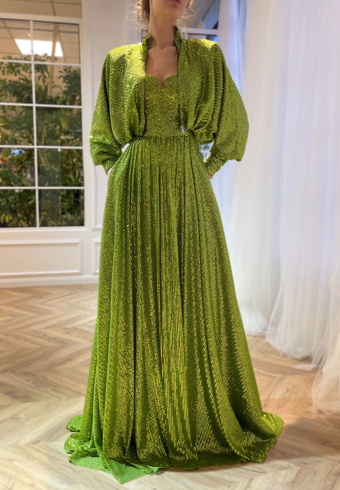 Green two piece dress with long sleeves and sequins