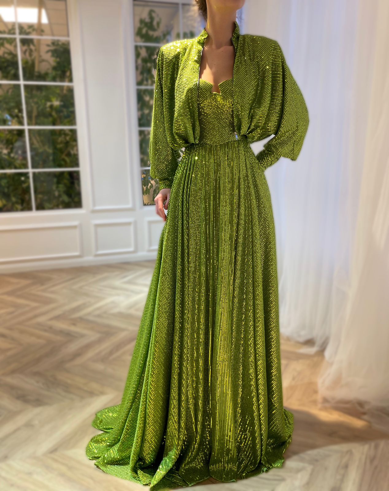 Green two piece dress with long sleeves and sequins