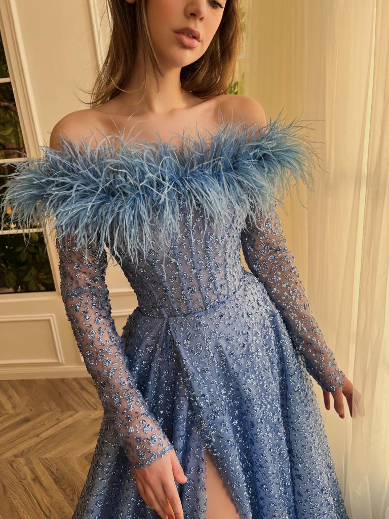 Blue A-Line dress with long off the shoulder sleeves, feathers, and beading