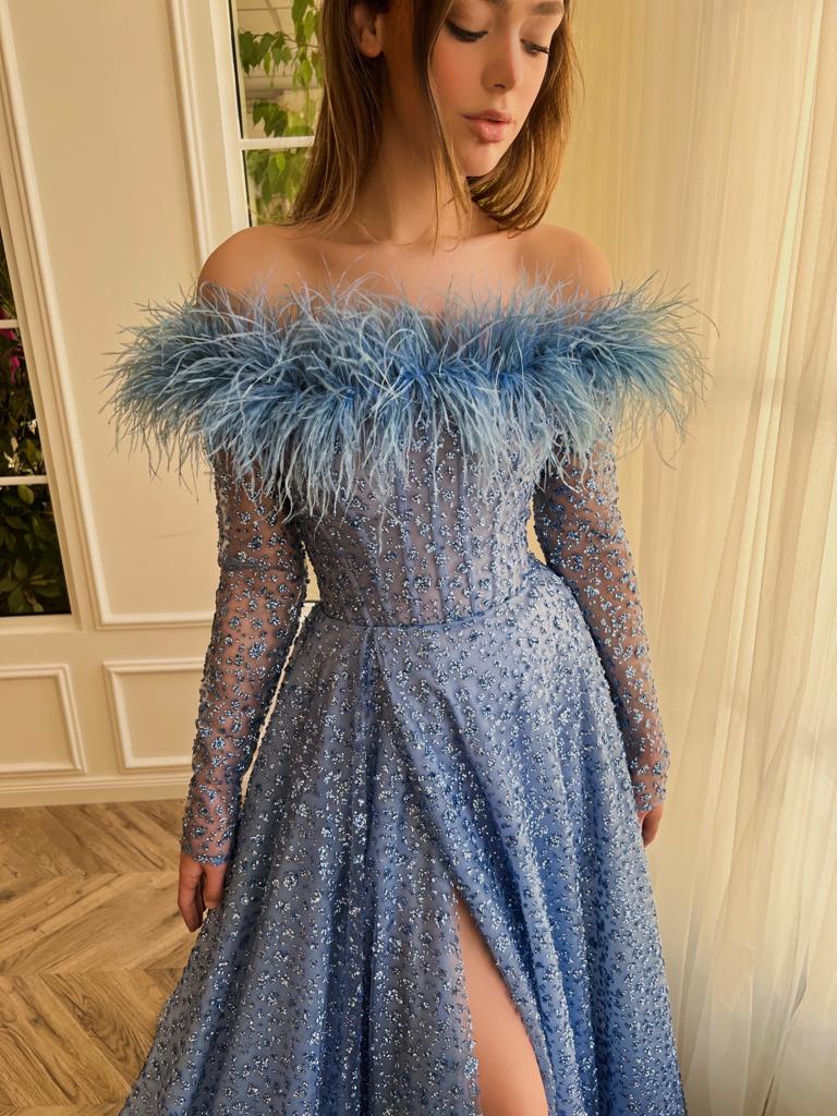 Blue A-Line dress with long off the shoulder sleeves, feathers, and beading