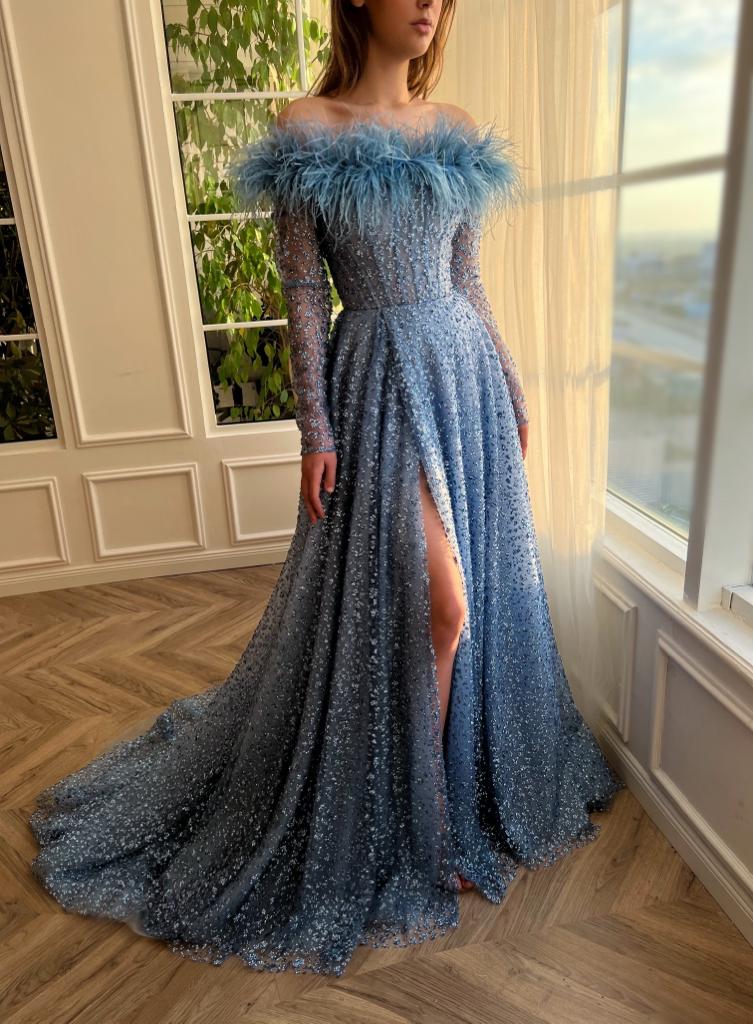 Blue A-Line dress with long off the shoulder sleeves, feathers, and beading