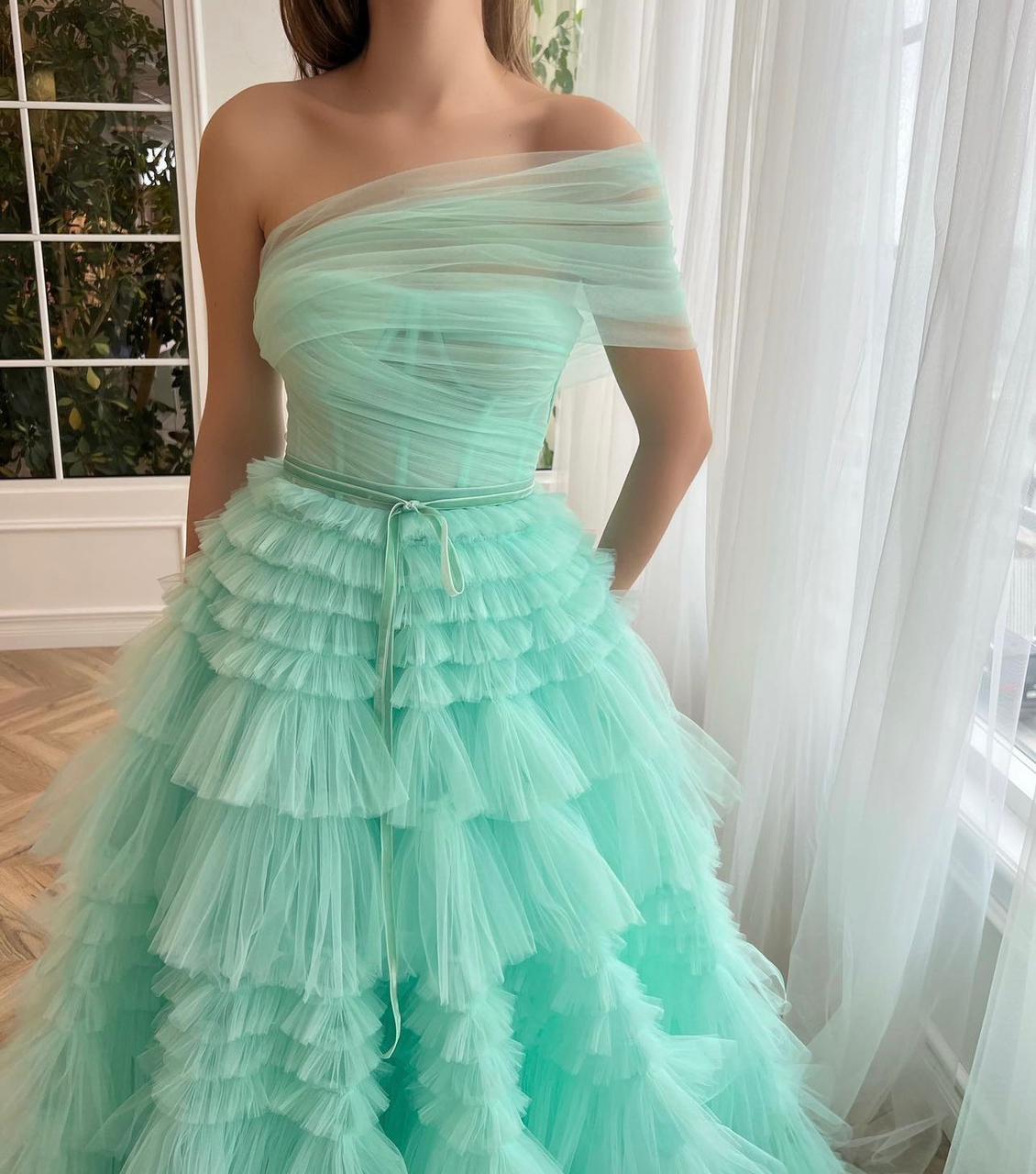 Turquoise A-Line dress with one shoulder sleeve and ruffles