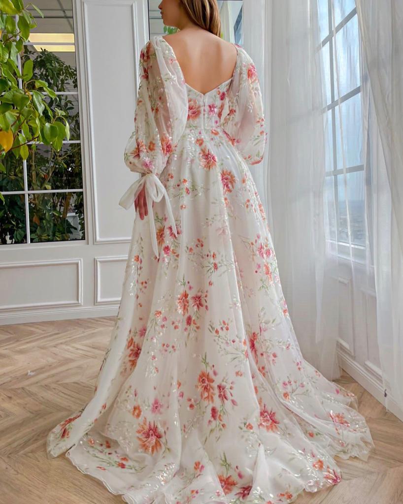 A line white bridal dress with long sleeves and embroidered flowers