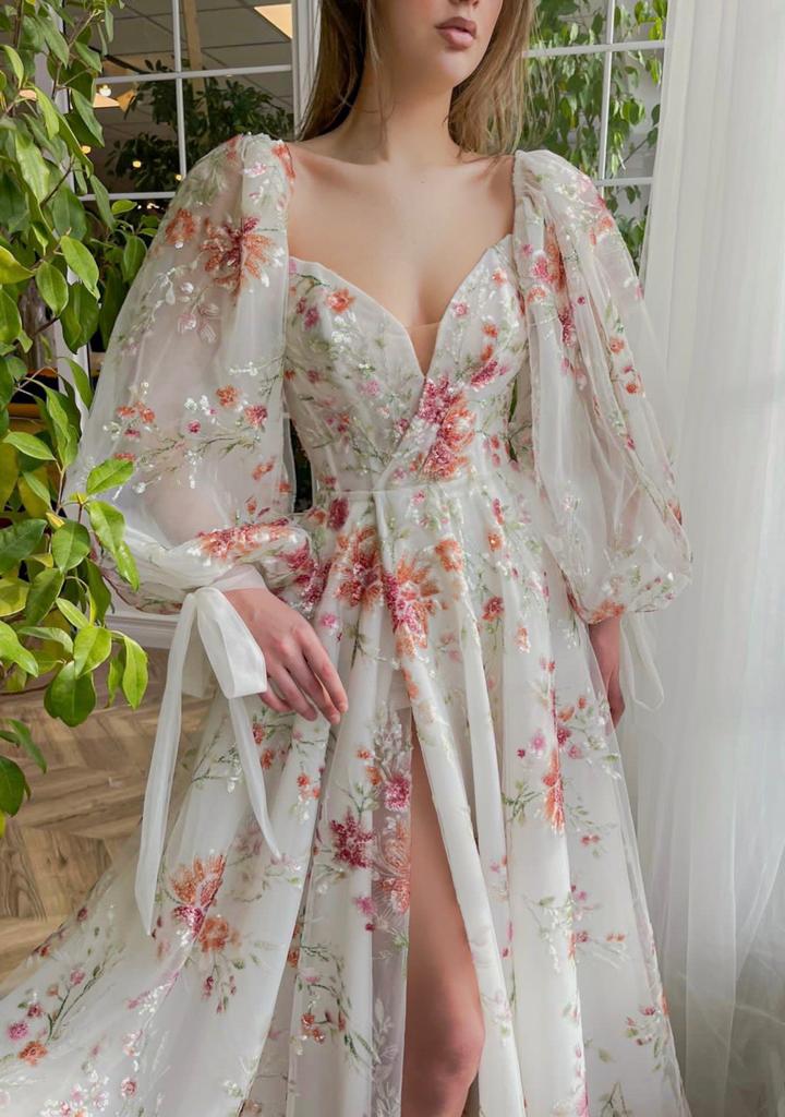 A line white bridal dress with long sleeves and embroidered flowers