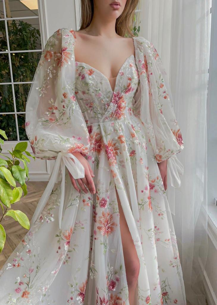 A line white bridal dress with long sleeves and embroidered flowers