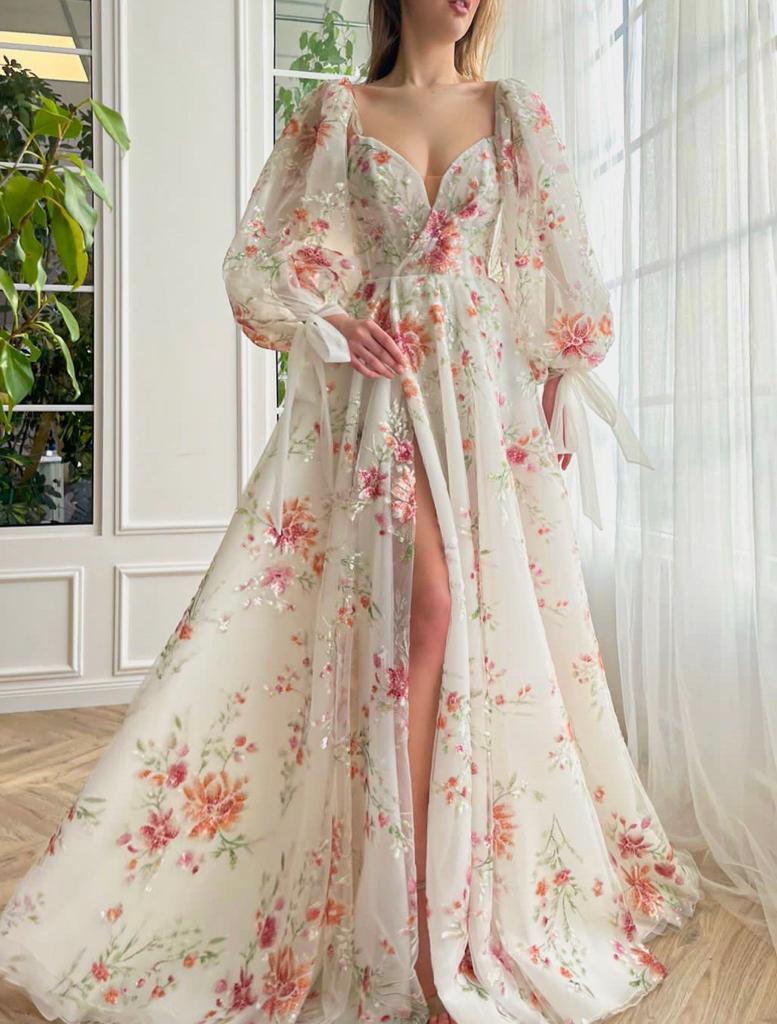 A line white bridal dress with long sleeves and embroidered flowers