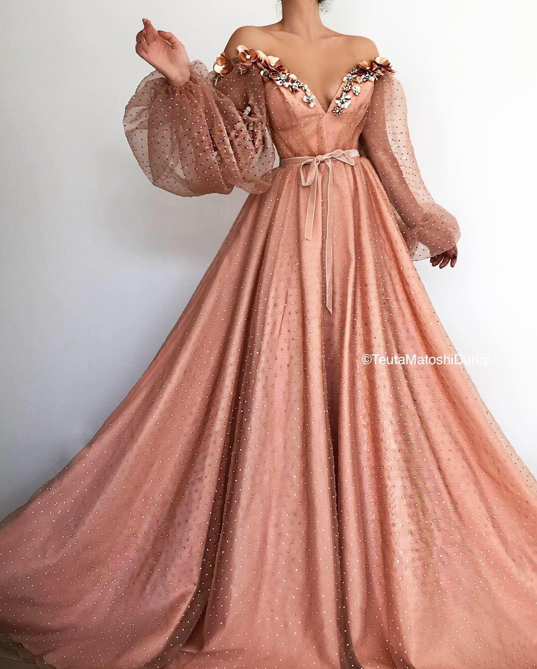 Pink A-Line dress with v-neck, long off the shoulder sleeves and embroidery