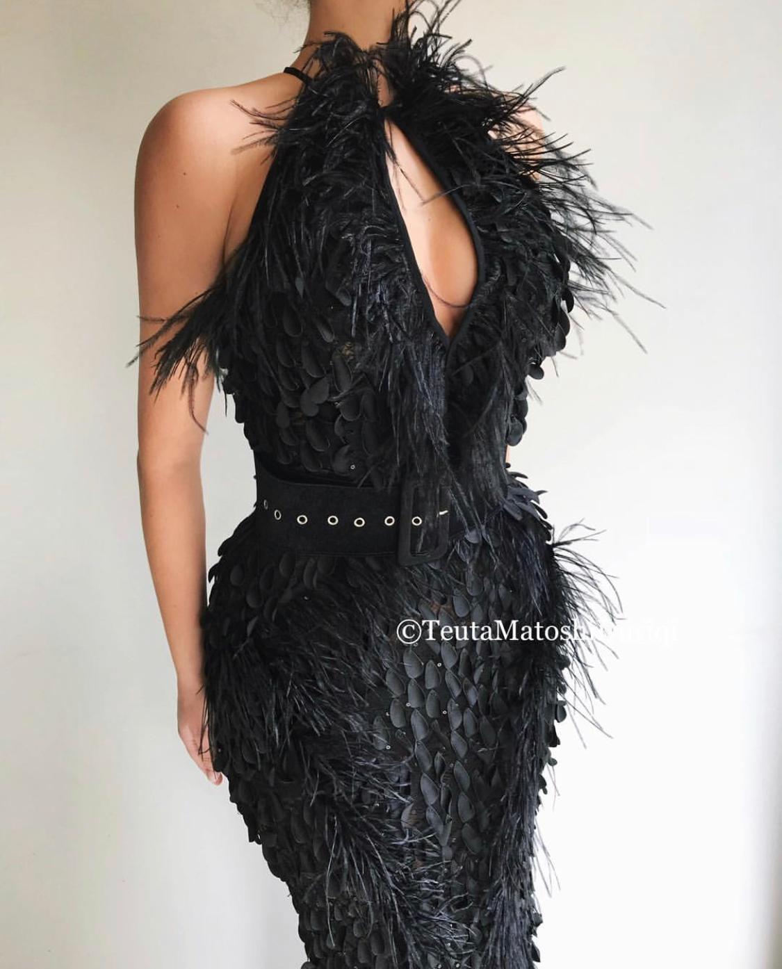 Black mermaid dress with belt, feathers and no sleeves