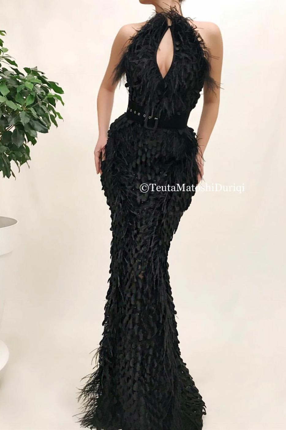 Black mermaid dress with belt, feathers and no sleeves