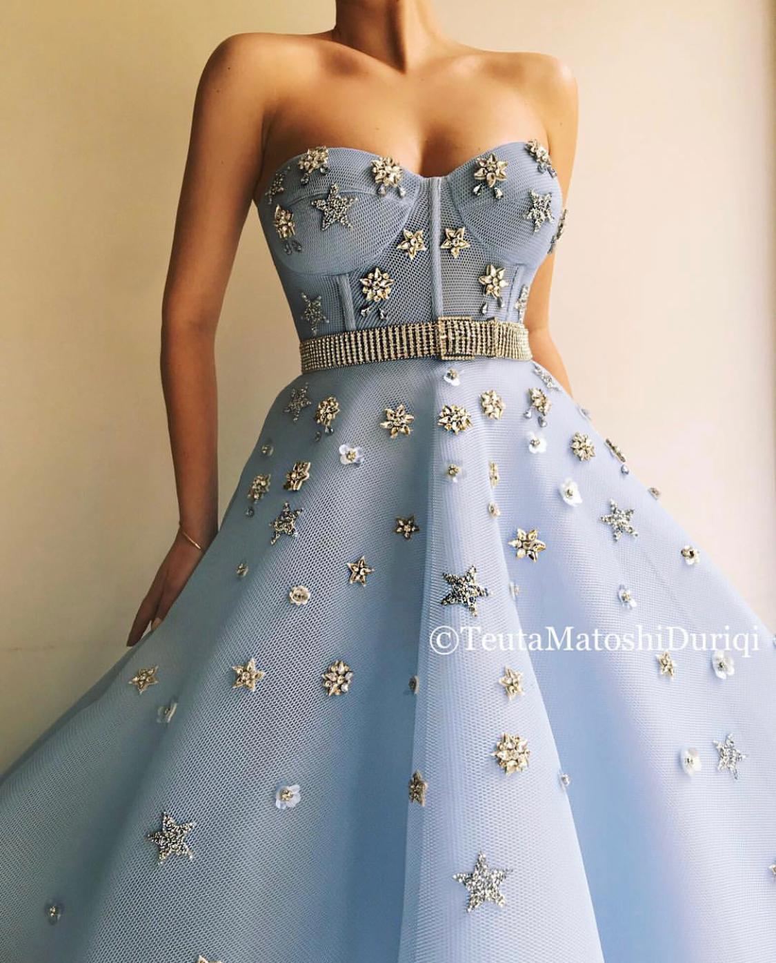 Blue A-Line dress with no sleeves, belt and starry fabric