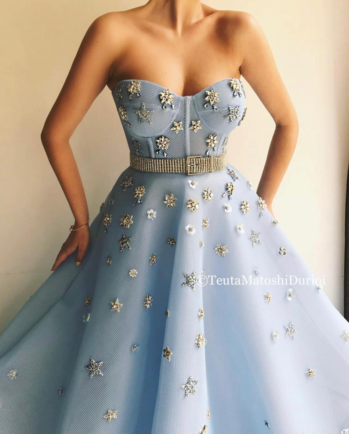 Blue A-Line dress with no sleeves, belt and starry fabric