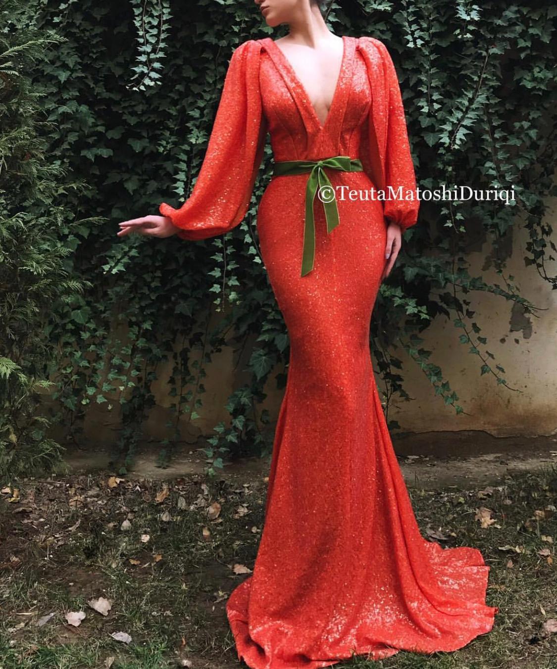 Orange mermaid dress with v-neck and long sleeves