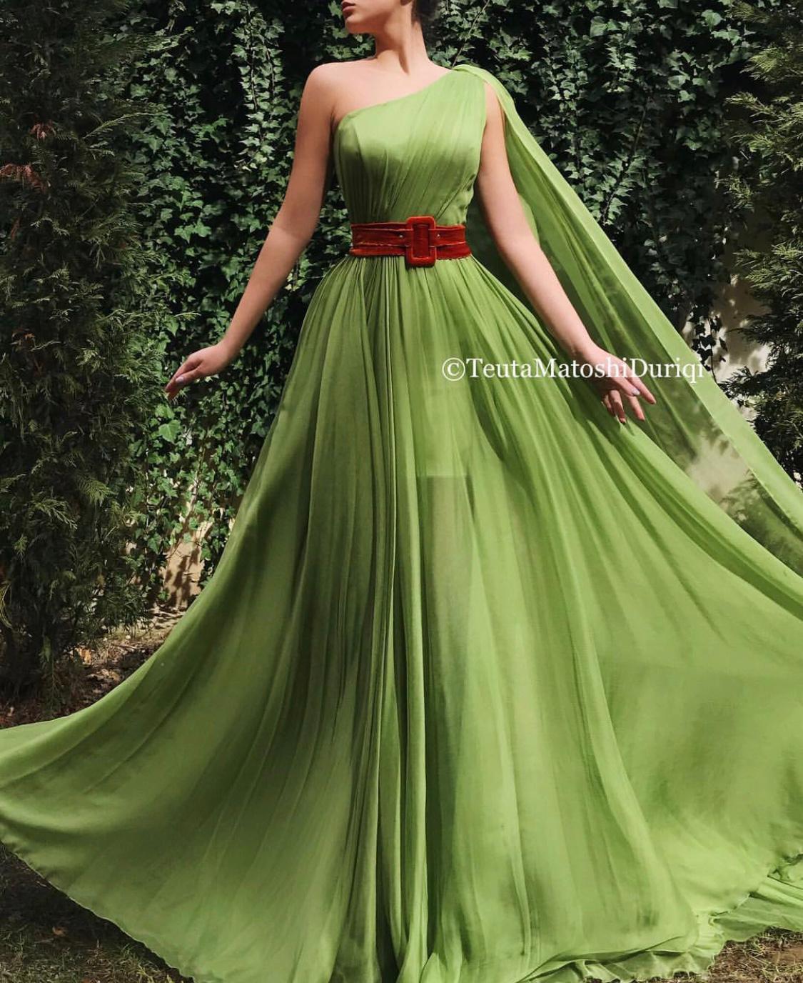 Green A-Line dress with belt and one shoulder cape sleeve