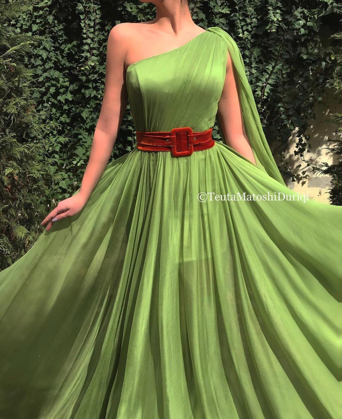 Green A-Line dress with belt and one shoulder cape sleeve