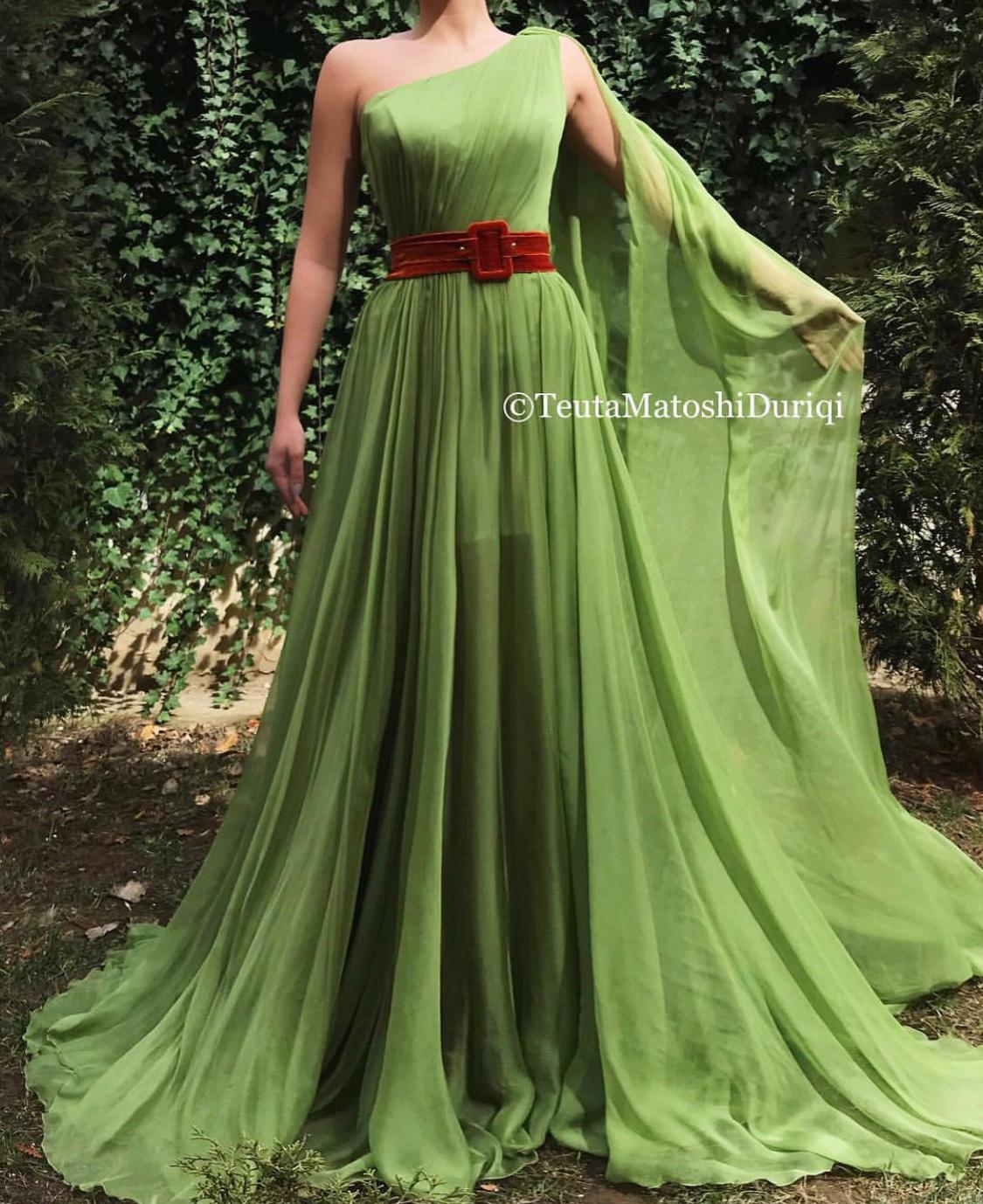 Green A-Line dress with belt and one shoulder cape sleeve