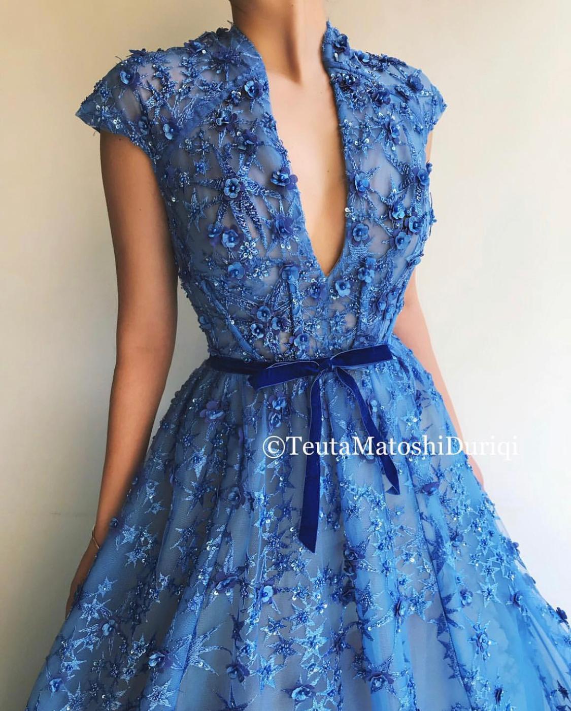 Blue A-Line dress with v-neck, no sleeves and embroidery