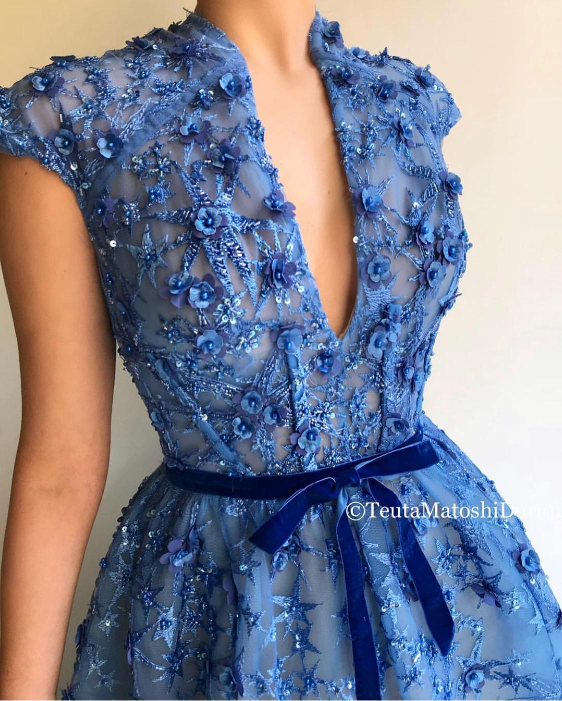 Blue A-Line dress with v-neck, no sleeves and embroidery