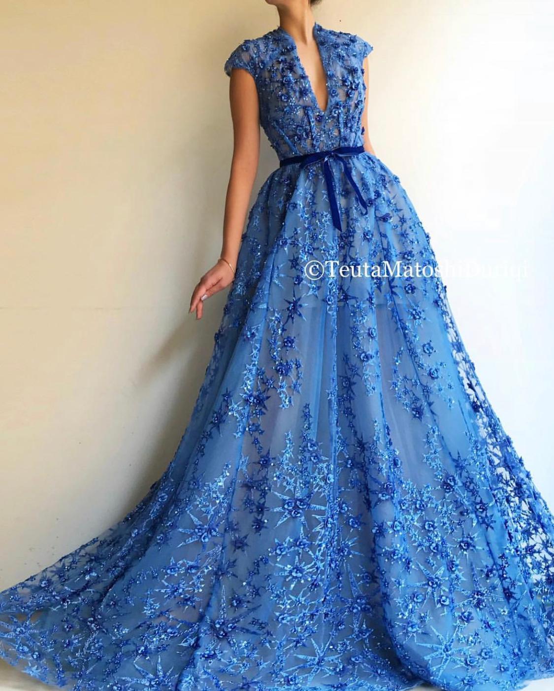 Blue A-Line dress with v-neck, no sleeves and embroidery