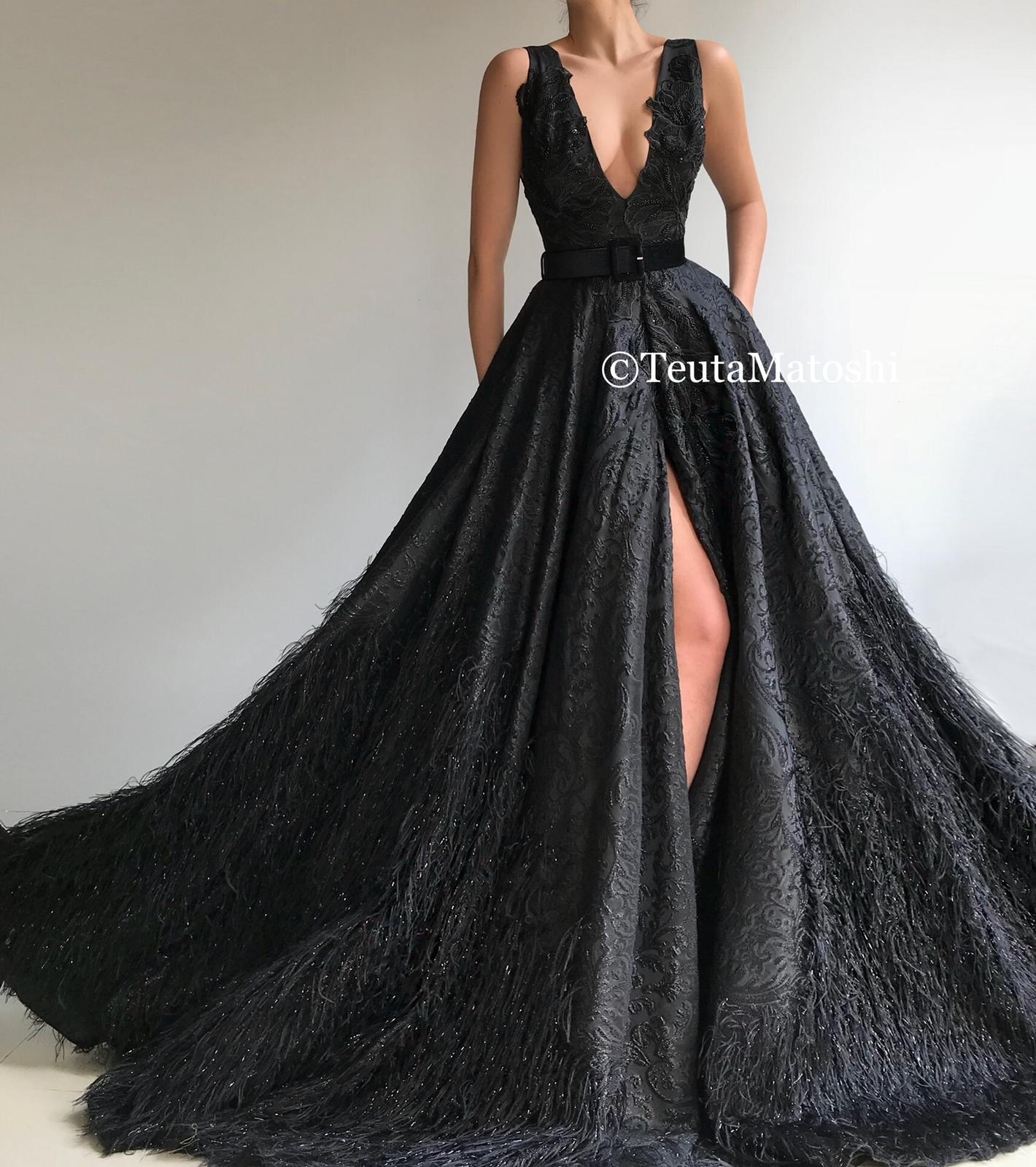 Black A-Line dress with v-neck, no sleeves and embroidery