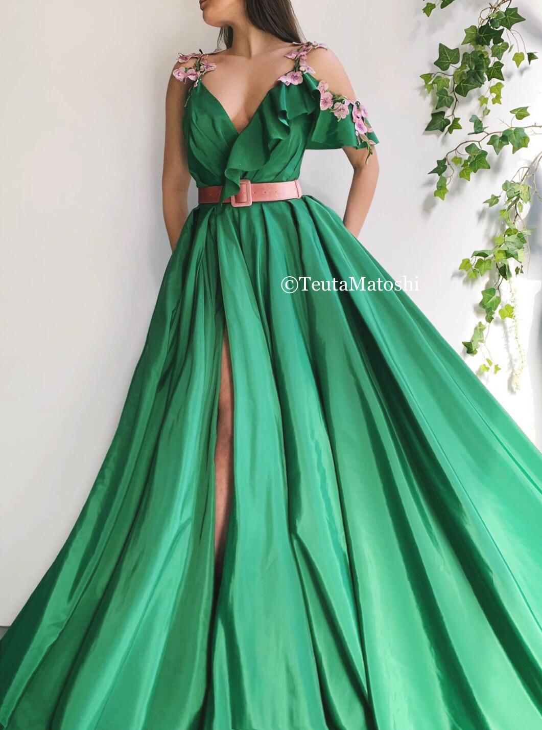 Green A-Line dress with one off the shoulder sleeve, straps, belt and embroidery