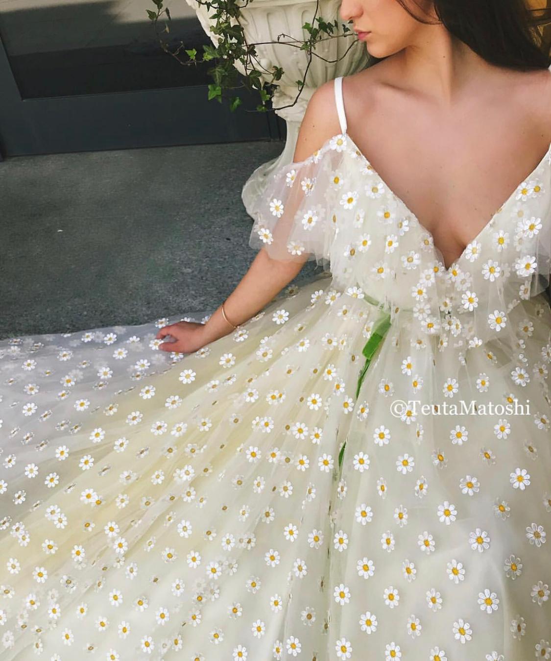 Beige A-Line dress with off the shoulder sleeves, spaghetti straps, v-neck and daisies