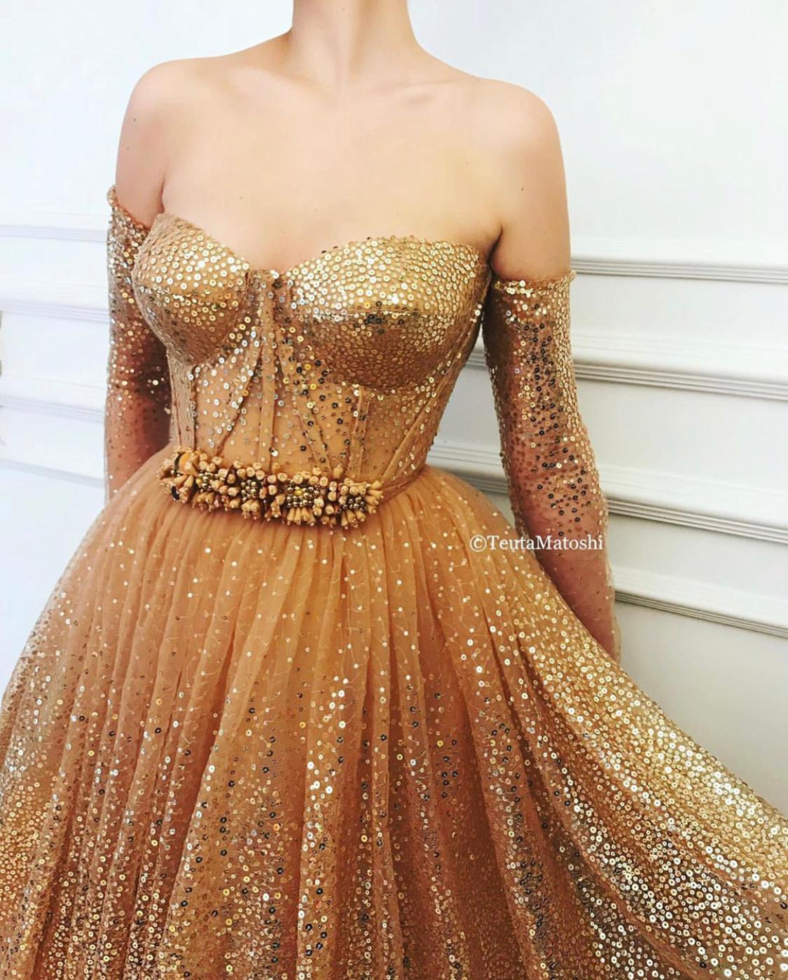 Gold A-Line dress with long off the shoulder sleeves and sequins