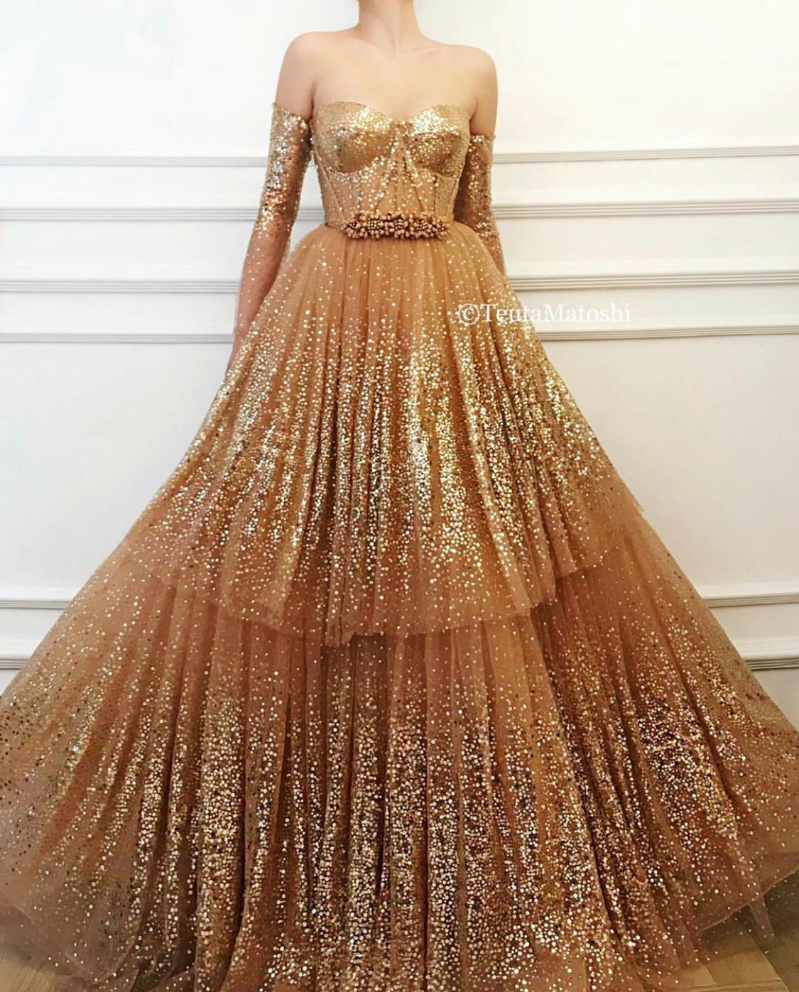 Gold A-Line dress with long off the shoulder sleeves and sequins