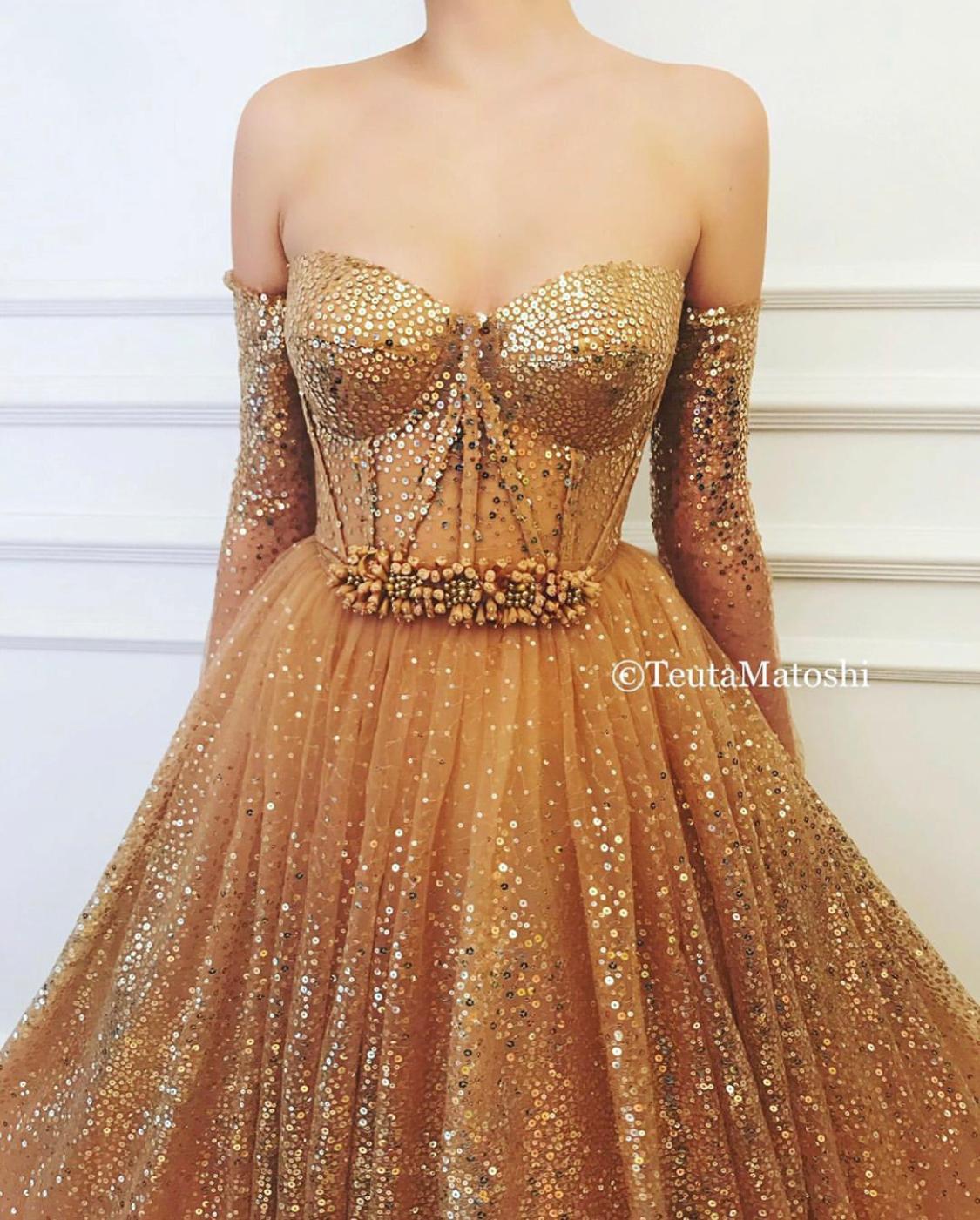 Gold A-Line dress with long off the shoulder sleeves and sequins