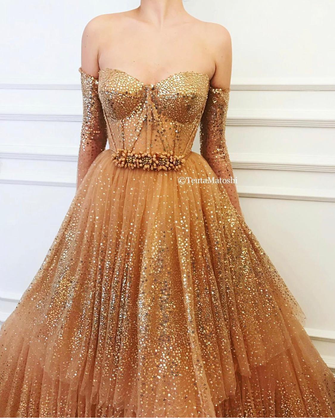 Gold A-Line dress with long off the shoulder sleeves and sequins