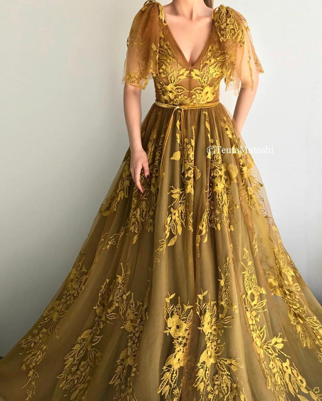 Gold A-Line dress with v-neck, no sleeves, lace and embroidery