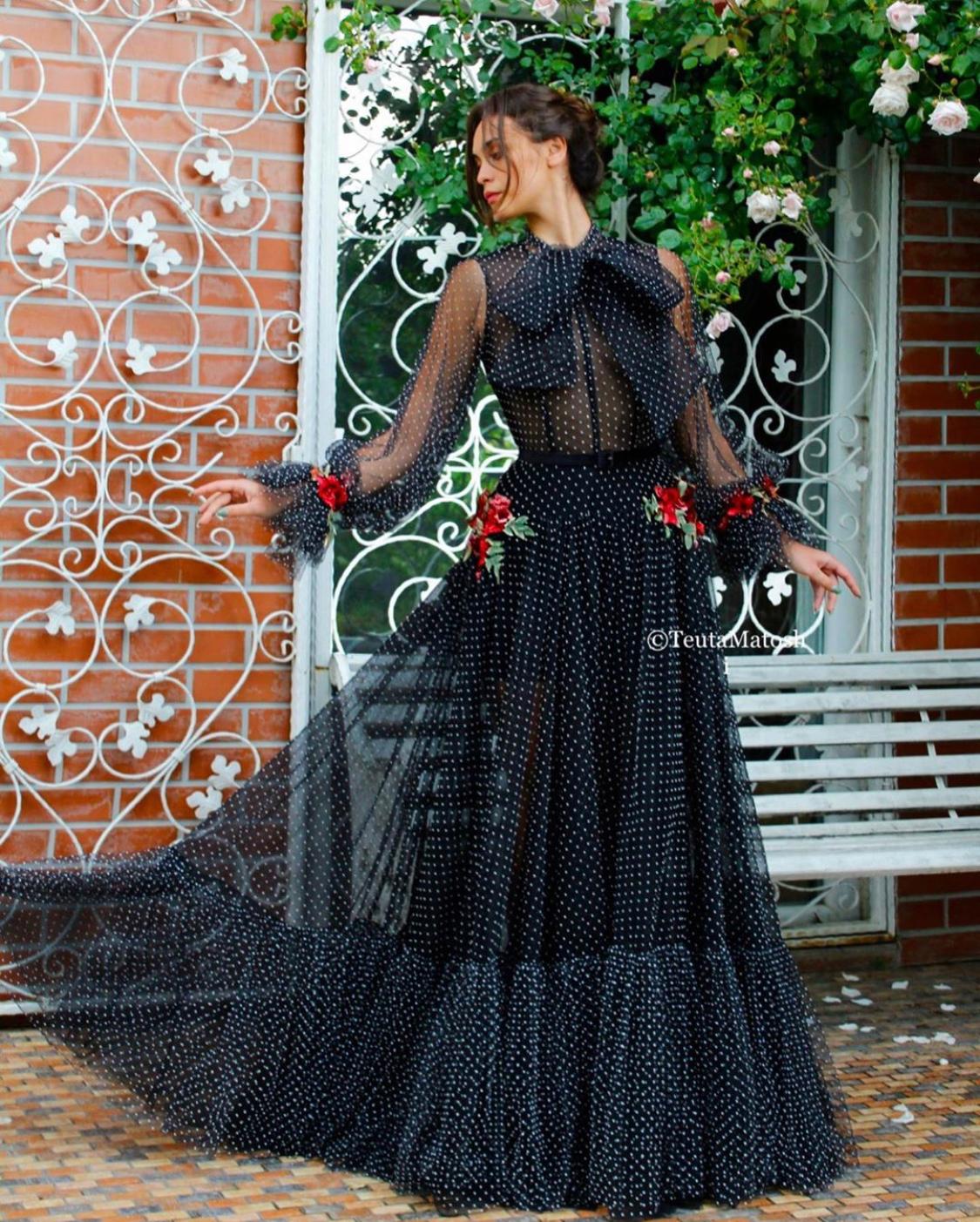 Black A-Line dress with dotted fabric, long sleeves, belt and embroidery