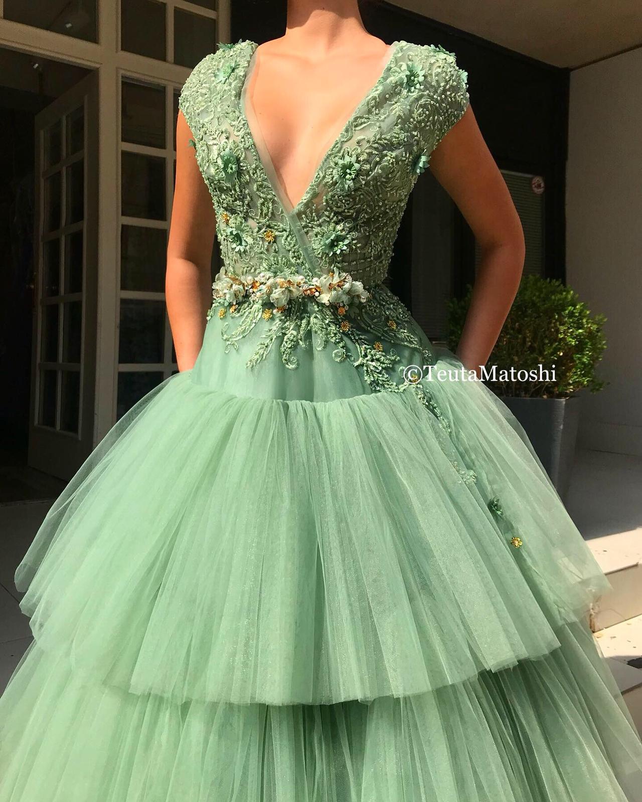 Green A-Line dress with no sleeves, v-neck and embroidery