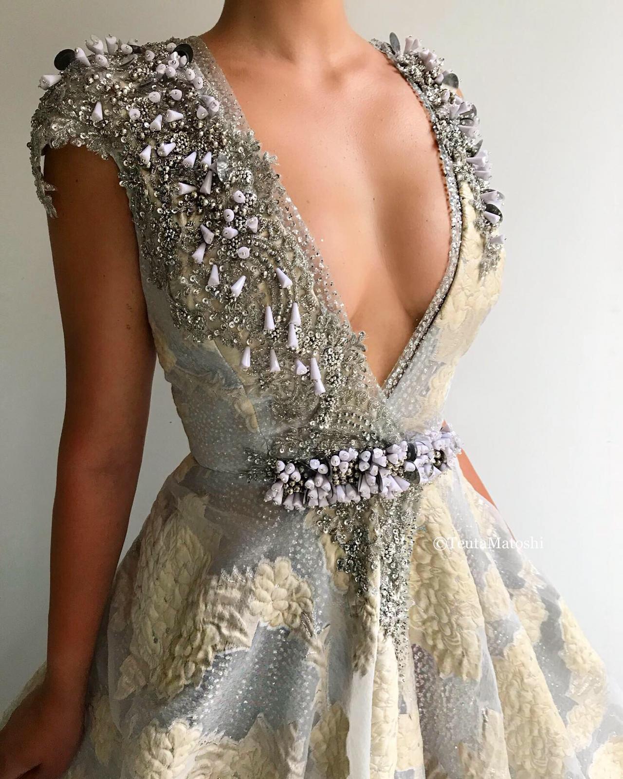 Grey A-Line dress with v-neck, no sleeves and embroidery