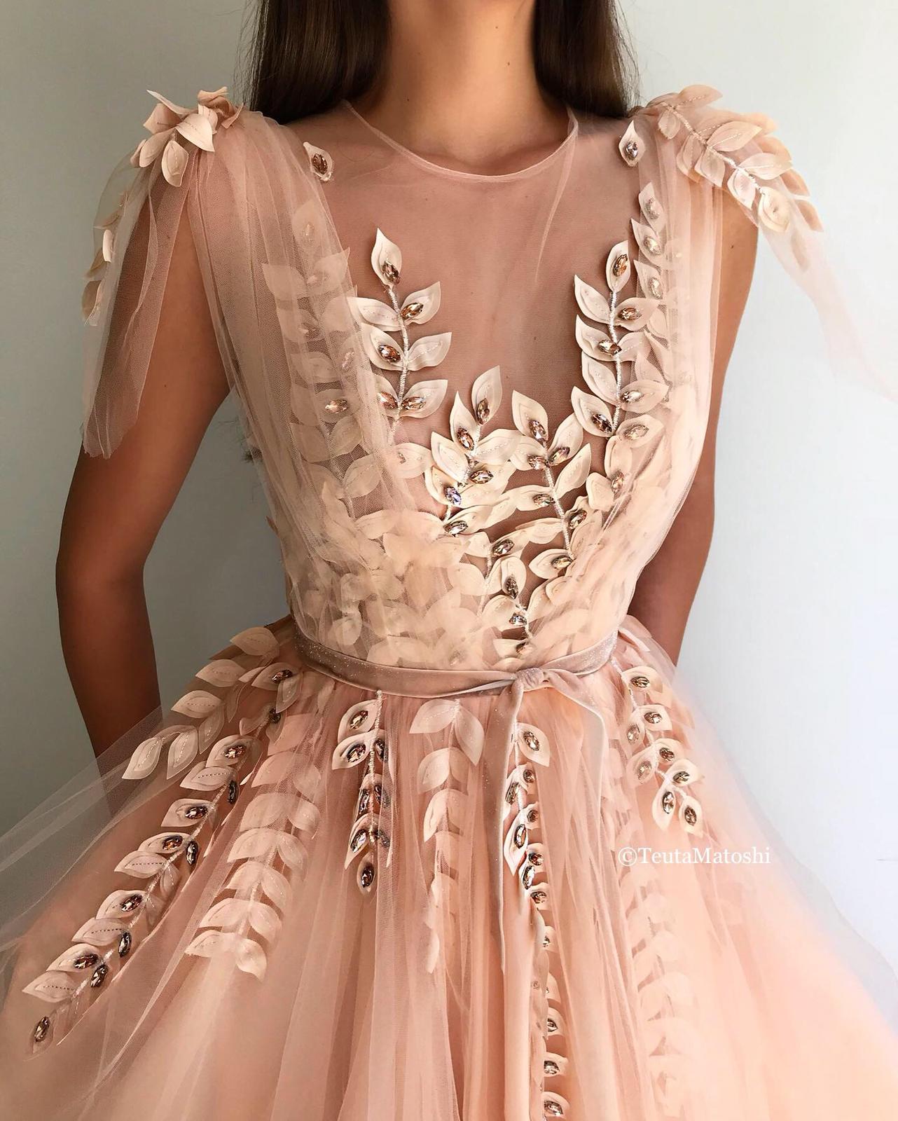 Peach A-Line dress with no sleeves and embroidery