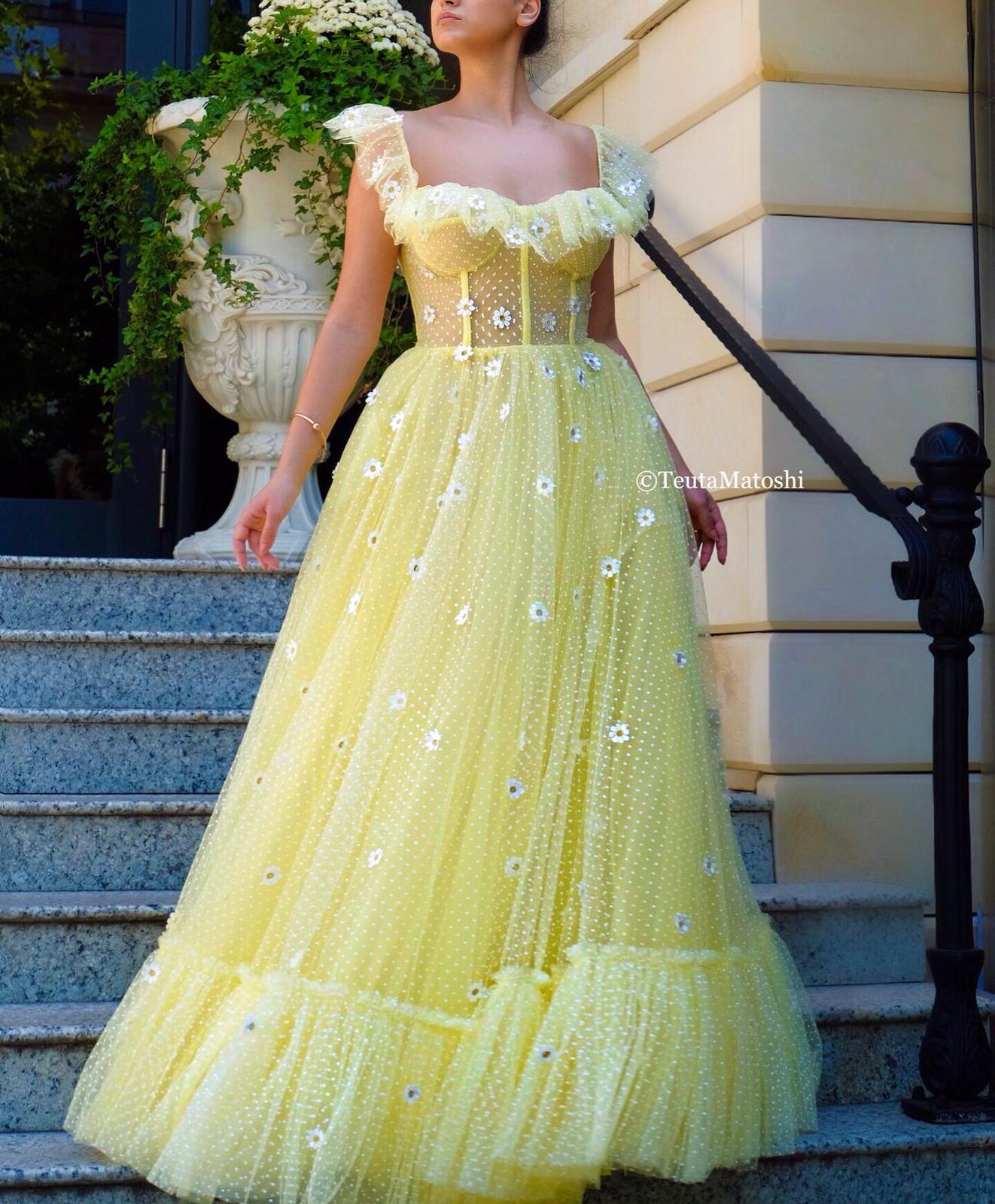 Yellow A-Line dress with dotted fabric and embroidered daisies