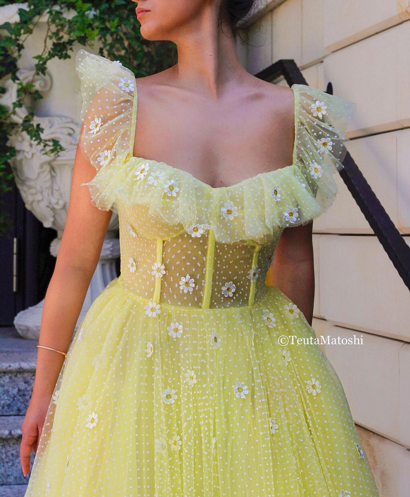 Yellow A-Line dress with dotted fabric and embroidered daisies
