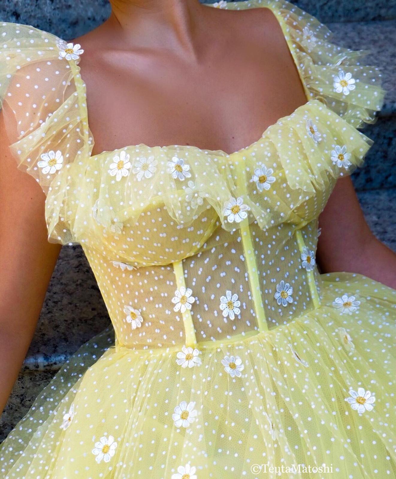 Yellow A-Line dress with dotted fabric and embroidered daisies