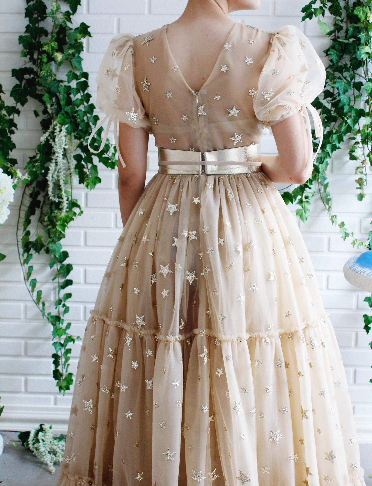Beige A-Line dress with short sleeves, v-neck and starry fabric