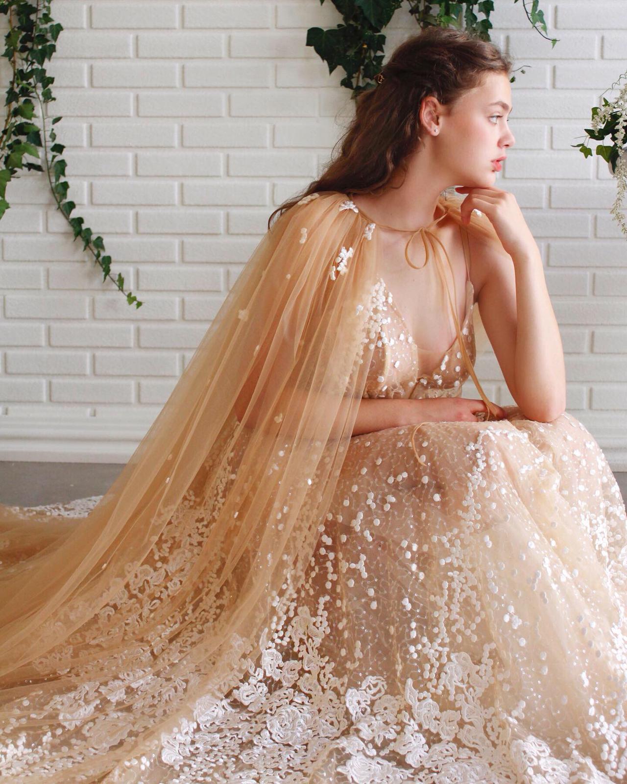 Beige A-Line dress with cape and embroidery