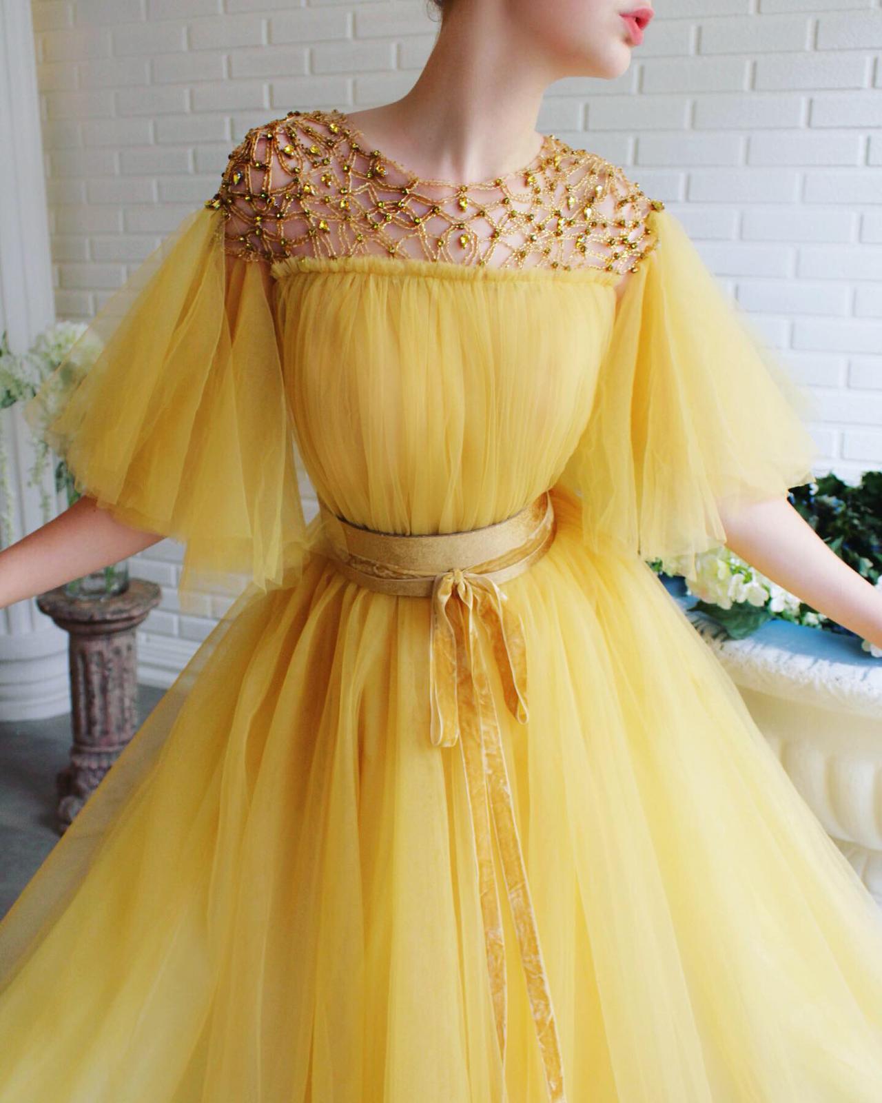 Yellow A-Line dress with short sleeves, belt and embroidery