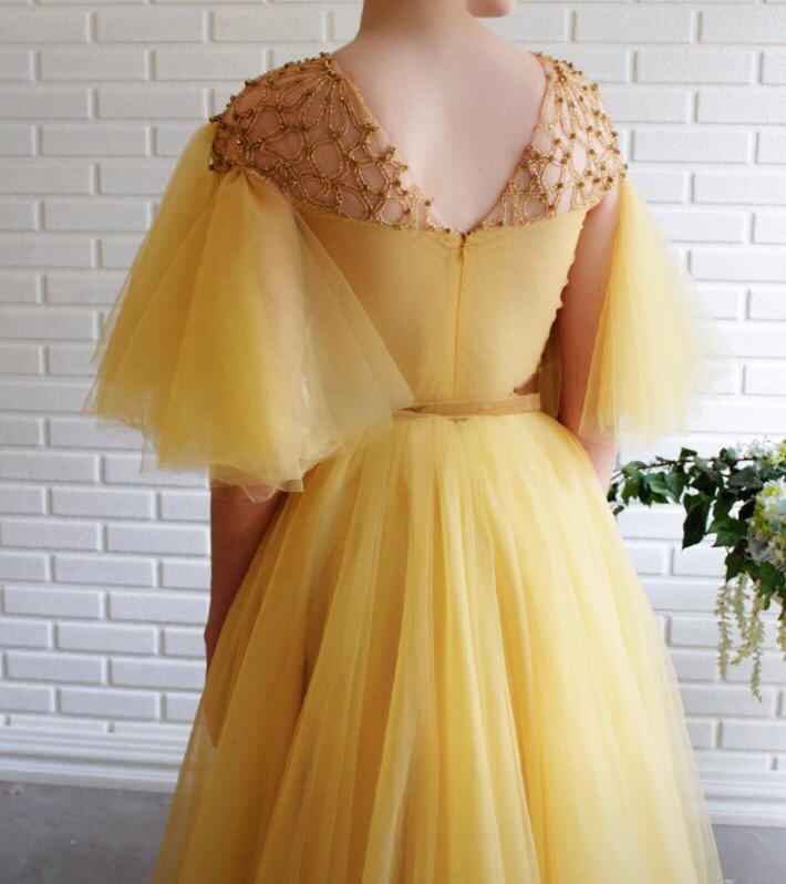 Yellow A-Line dress with short sleeves, belt and embroidery