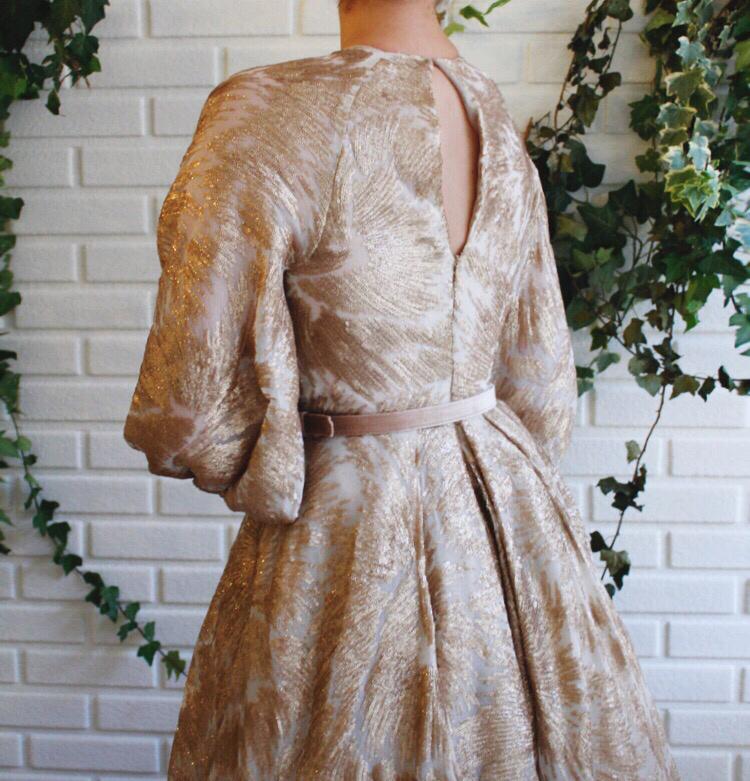 Beige A-Line dress with long sleeves and belt
