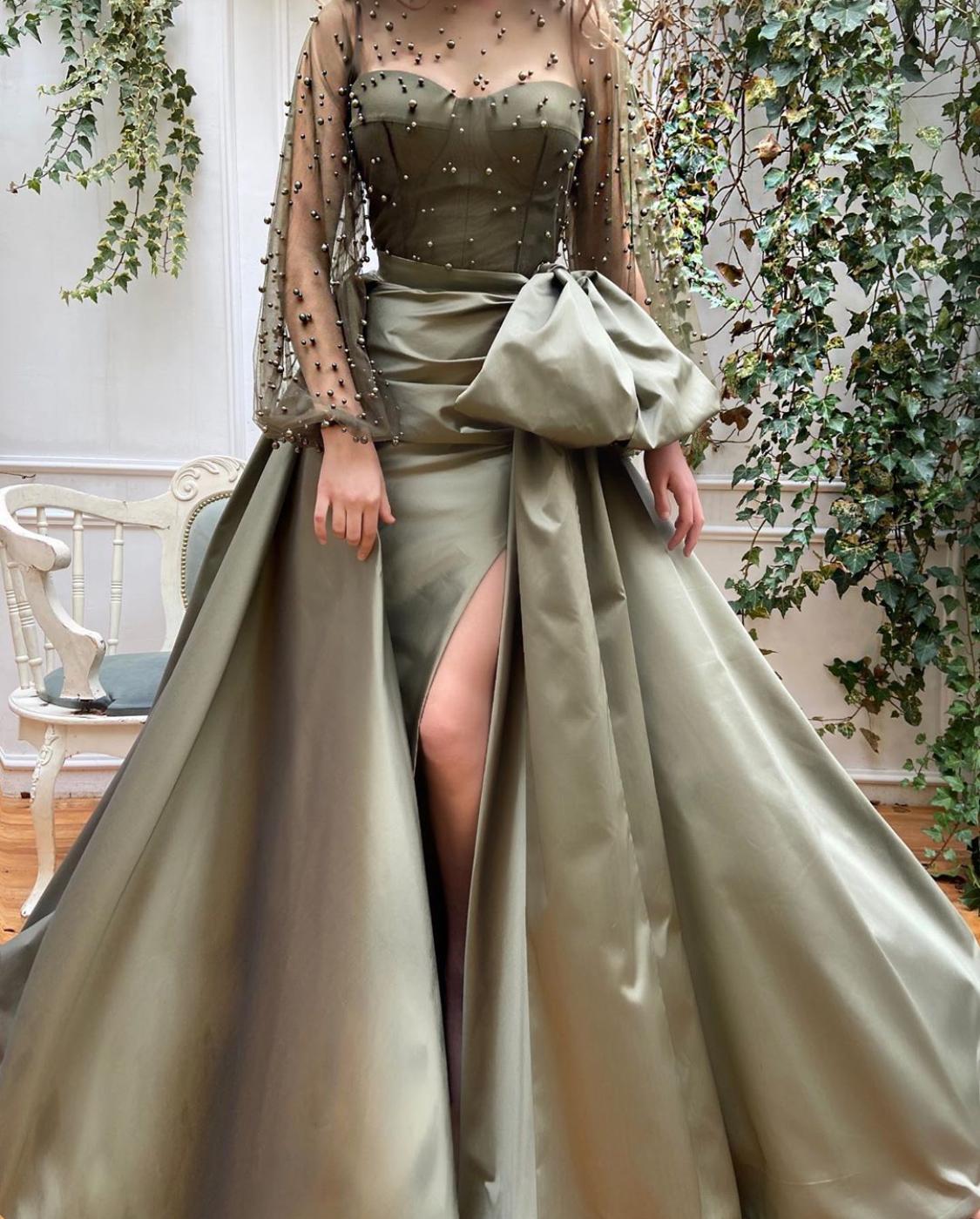 Green overskirt dress with long sleeves and beading